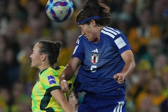 Japan’s Hana Takahashi, right, battles for the ball against Australia’s Caitlin Foord during the Women’s Asian Cup final.