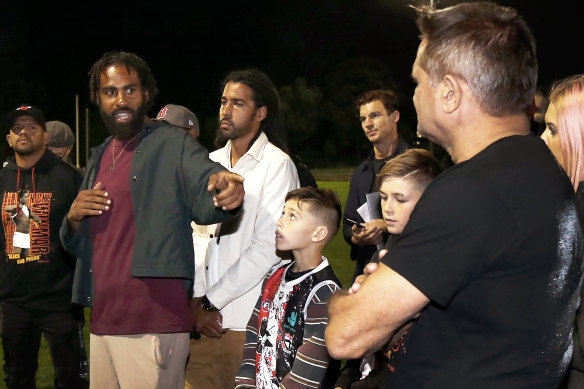 Heritier Lumumba with Nicky Winmar (right).