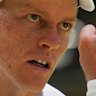 Jannik Sinner reacts after winning a point.