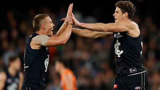 MELBOURNE, AUSTRALIA - JULY 24: Patrick Cripps (left) and Charlie Curnow of the Blues celebrate during the 2022 AFL Round 19 match between the Carlton Blues and the GWS Giants at Marvel Stadium on July 24, 2022 in Melbourne, Australia. (Photo by Michael Willson/AFL Photos via Getty Images)
