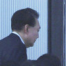 Impeached South Korean President Yoon Suk Yeol arrives at the Corruption Investigation Office for High-ranking Officials in Gwacheon.