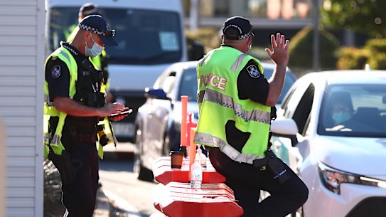 Queensland Police stop cars in Griffith street Coolangatta at the Queensland border.