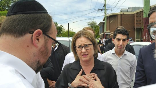 Premier Jacinta Allan with community members outside the synagogue on Friday.