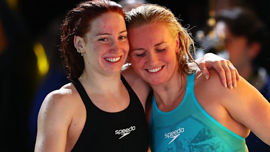 Ariarne Titmus celebrates with Mollie O’Callaghan after both qualified for the women’s 200m freestyle under world-record time.
