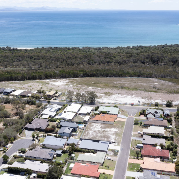 Aerial view of the razed site for a new development that will become the only visible building above the sand dunes at Main Beach in the small holiday town of South West Rocks, NSW. 30 November 2023 Photo: Janie Barrett