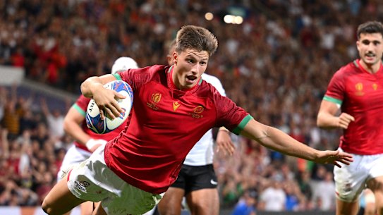 Rodrigo Marta of Portugal scores a try against Fiji.
