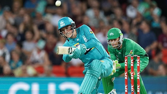 Heat rising: Tom Banton slugs a six for Brisbane at Metricon Stadium.