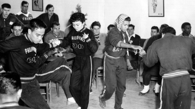 Athletes from around the world dance in the 1956 Olympic Village, West Heidelberg.