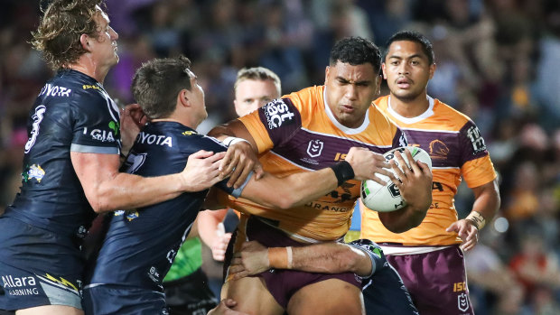 Tevita Pangai jnr forces his way through during Thursday night's Queensland derby.