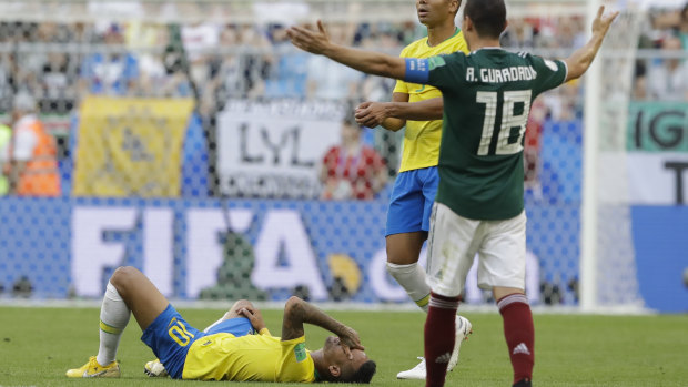 Neymar lies on the ground during Brazil's clash with Mexico.