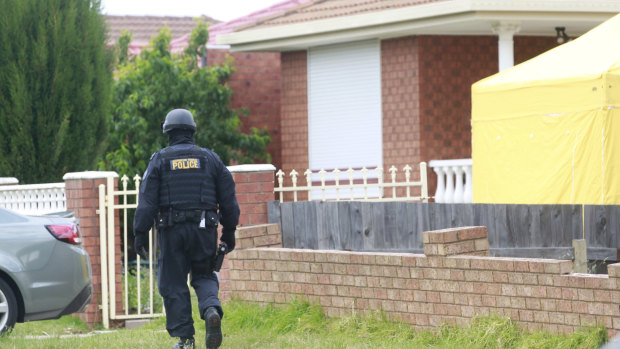 Police in Meadow Heights in the street where Hassan Khalif Shire Ali lived.