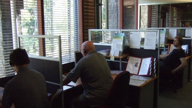 Counsellors work the phones for the Men's Referral Service.