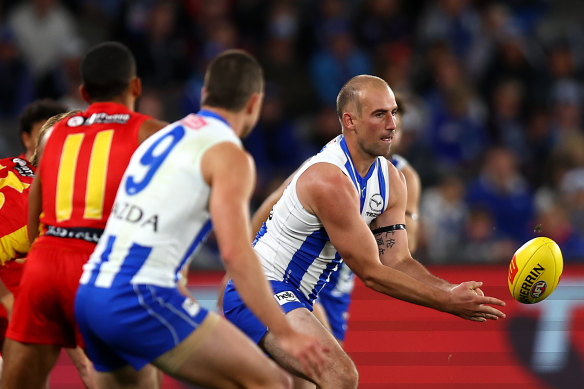 Ben Cunnington gets a handball away for the Kangaroos.