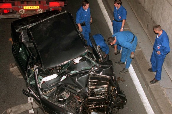 Police services prepare to take away the car in which Princess Diana and her companion Dodi Fayed were travelling on August 31, 1997.