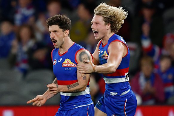Tom Liberatore (left) and teammate Cody Weightman during the Bulldogs’ round-22 clash with the Kangaroos.
