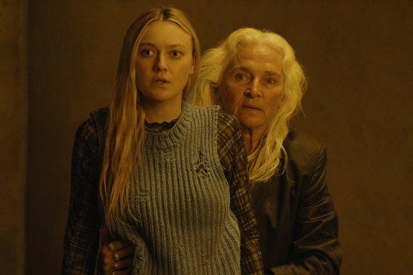 Dakota Fanning stars as Mina, who becomes lost in the woods, where she meets Madeline (Olwen Fouere). 