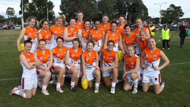 Kate Lambeski (third right, middle row) with her AFL teammates.