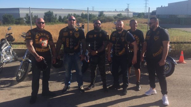 Robert Ale, pictured in the centre and third from the left, stands beside now jailed Comanchero president Mick Murray (second from the left) and other members.