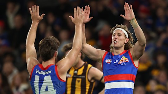 E, AUSTRALIA - JUNE 24: Aaron Naughton of the Bulldogs celebrates after scoring a goal during the round 15 AFL match between the Western Bulldogs and the Hawthorn Hawks at Marvel Stadium on June 24, 2022 in Melbourne, Australia. (Photo by Robert Cianflone/Getty Images)