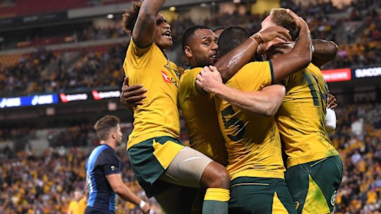 The Wallabies celebrate a try against Argentina.