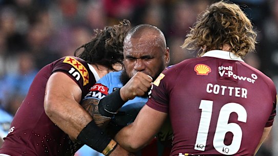 Reuben Cotter and Tino Fa’asuamaleaui get in the face of Junior Paulo during Origin II at Suncorp Stadium.