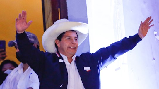 Newly Elected President of Peru Pedro Castillo waves at supporters.