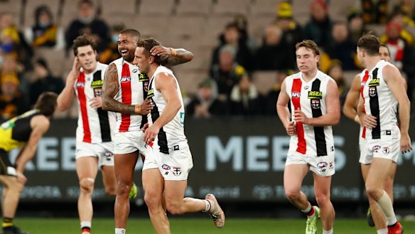 Luke Dunstan of the Saints celebrates a goal with his teammates. 