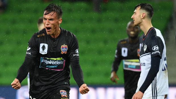 Deciding strike: Newcastle's Patrick Langois scores a late winner against Victory at AAMI Park in Melbourne.