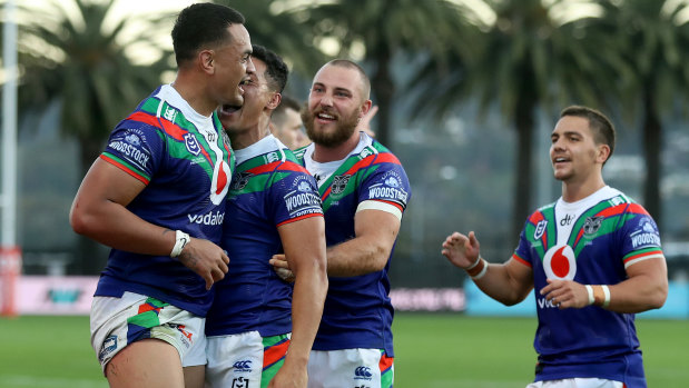 The Warriors celebrate Ken Maumalo's try-saving tackle against St George Illawarra in Gosford on Saturday.