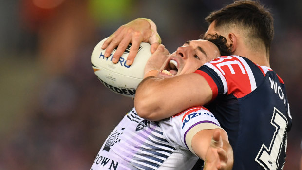 Big squeeze: Ryan Matterson gets to grips with Billy Slater.