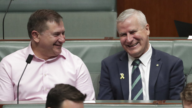 Rebel Queensland MP Llew O'Brien shares a joke with Deputy Prime Minister Michael McCormack in Parliament on Thursday