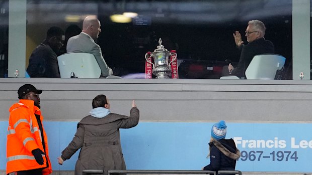 Gary Lineker interacts with a fan before an FA Cup quarter-final in 2023.