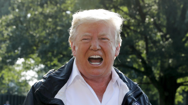 US President Donald Trump speaks to members of the media before boarding Marine One on the South Lawn of the White House in Washington, DC.