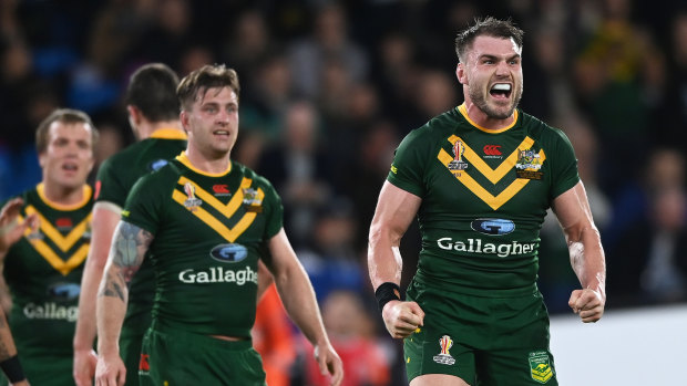 Angus Crichton and the Kangaroos celebrate after the full-time siren.