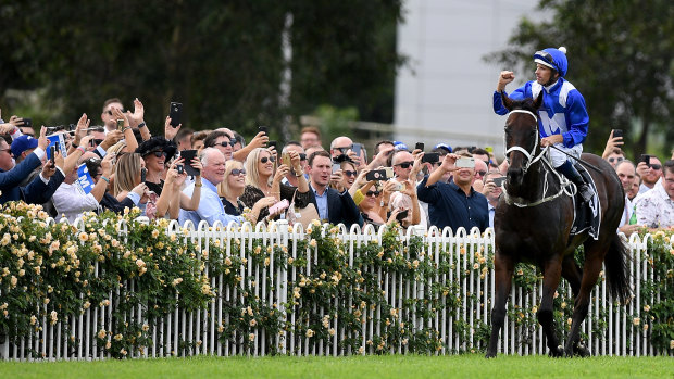 Will we ever see her likes again?: Hugh Bowman and Winx soak up the adulation of the crowd on Golden Slipper day at Rosehill.