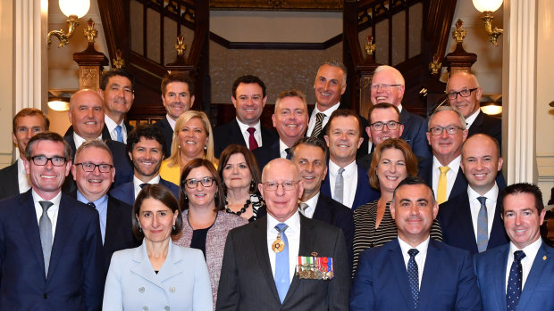 NSW Premier Gladys Berejiklian and her new 24-member ministry pose for a photo with NSW Governor David Hurley at Government House in Sydney last week.