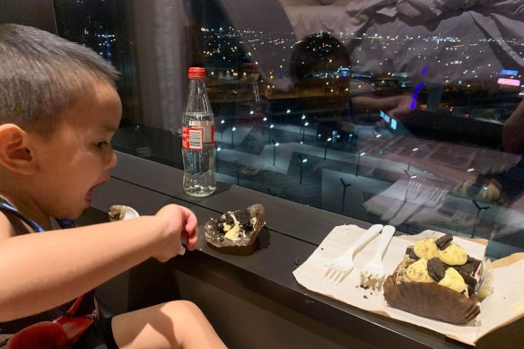 Sam with dessert at the Pan Pacific, overlooking South Wharf.