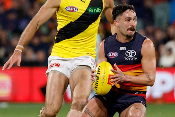 Izak Rankine tries to dodge Richmond.