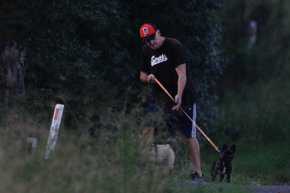 One Nation MP Mark Latham on an early morning walk with his dogs near his home on Saturday.