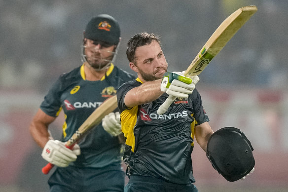 Josh Inglis celebrates his century during the first T20 cricket match between India and Australia.