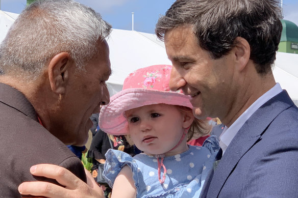 Neve Te Aroha Ardern Gayford, centre, networks with dad and NZ first bloke Clarke Gayford, right, during a day out in Ratana, New Zealand.