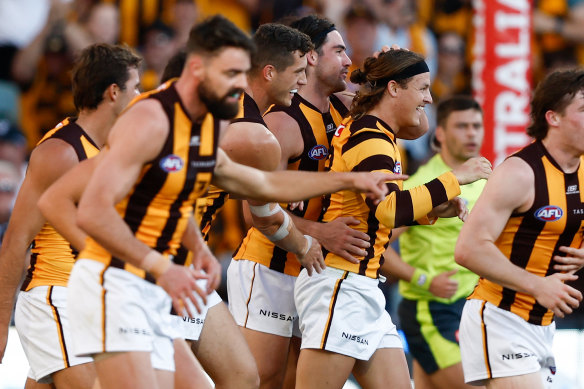 Hawthorn celebrate a goal.