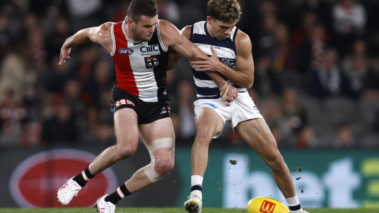 Brad Crouch of the Saints competes with Tyson Stengle of the Cats.