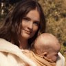 Laura Henshaw, with baby Atlas. Laura wears Max Mara coat. Zara dress and boots. Atlas wears Nature Baby (throughout).