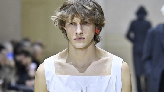 Delicate cottons and bold earrings on the Prada runway in Milan.