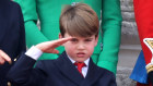 Prince Louis of Cambridge salutes as he watches the fly-past on the Buckingham Palace balcony during Trooping the Colour 2023.
