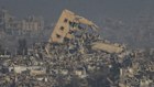Destroyed buildings in Gaza Strip are seen from southern Israel on Monday. 