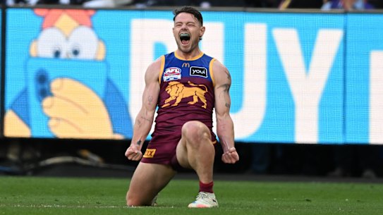 Lachie Neale celebrates his monster goal on the run after being subbed into the grand final at half-time.