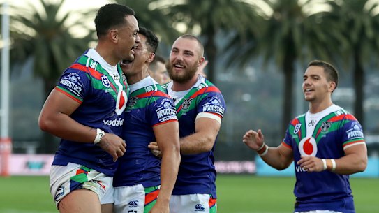 The Warriors celebrate Ken Maumalo's try-saving tackle against St George Illawarra in Gosford on Saturday.