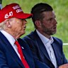 President Donald Trump and his son Eric go golfing in Florida as markets tank.